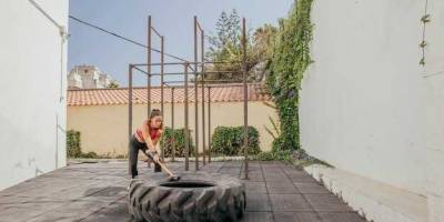 How far should retaining wall be from house