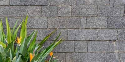 How much paver base do I need for retaining wall
