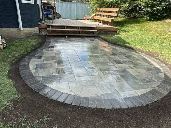 Tiered bubbler fountain bowls recirculating water in a Calgary garden by Sungreen
