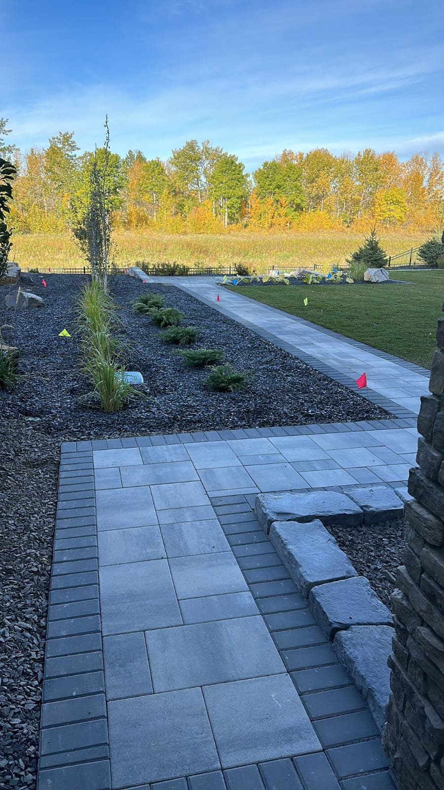 Paving-stone walkway and hardscape in a Calgary yard by Sungreen.