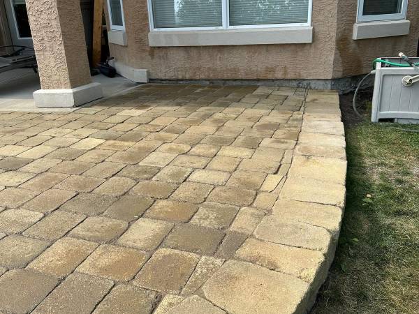 Multi-board wood deck and walkway beside a planted Calgary yard by Sungreen.