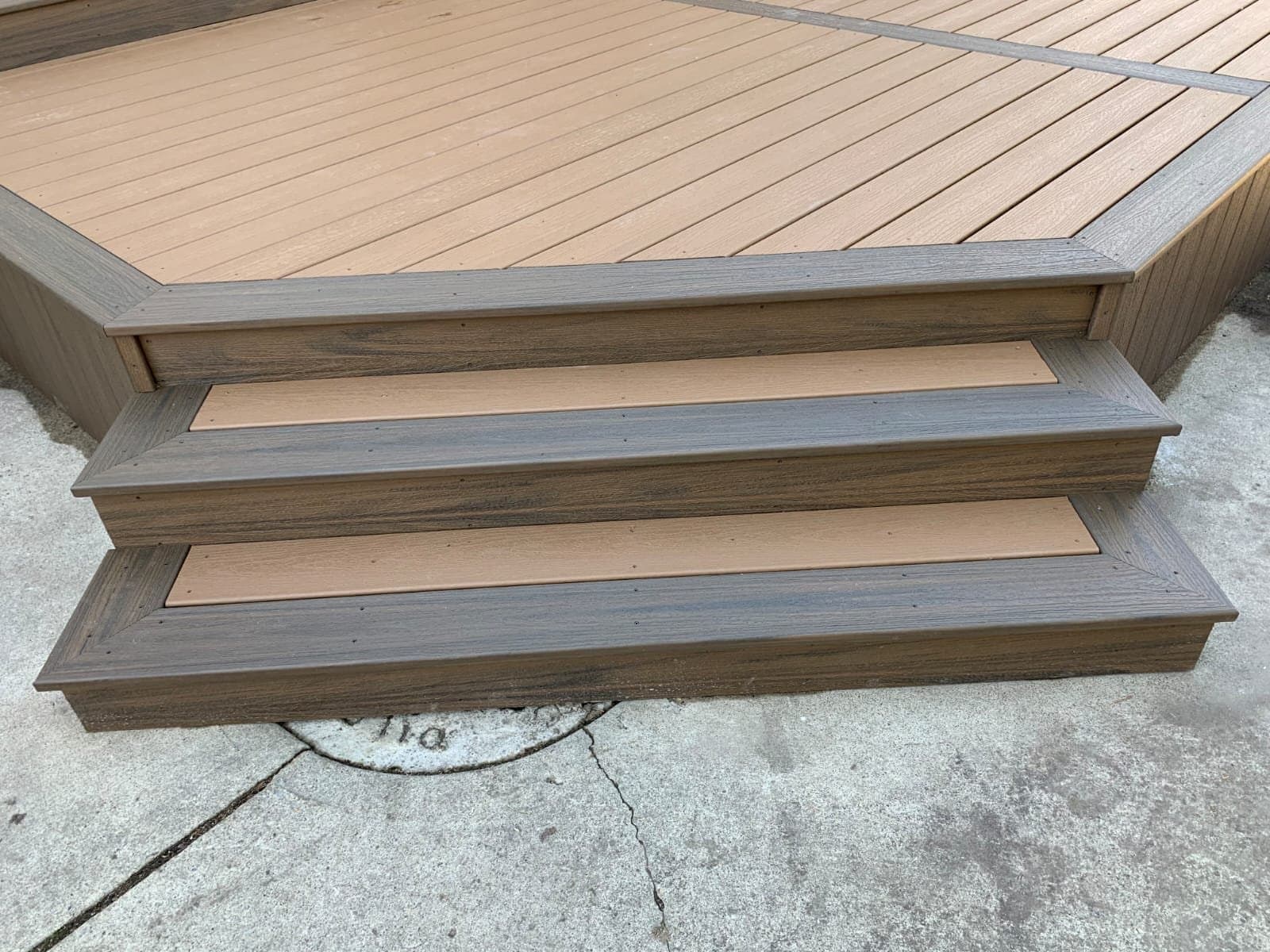 Newly built wood deck stairs with clean stringers at a Calgary home by Sungreen.