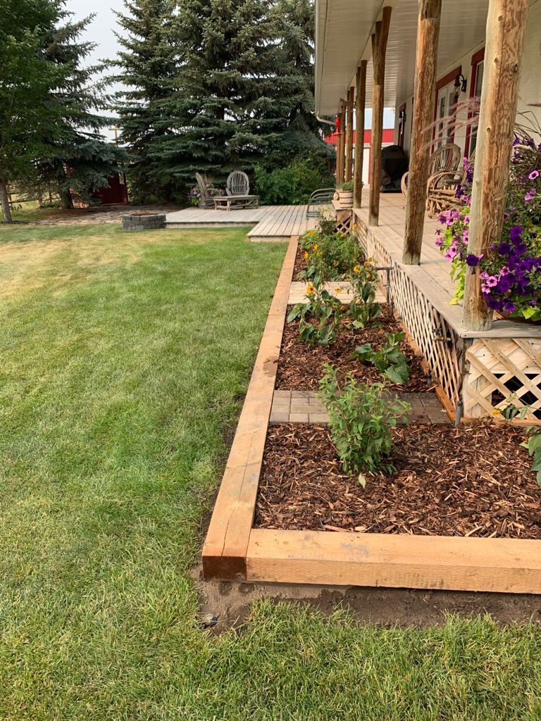 Newly installed wood fence line on a prepared Calgary lot by Sungreen.