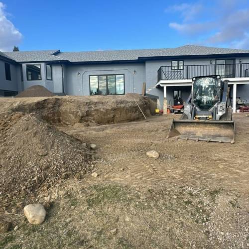 Paving-stone patio under construction in Calgary showing the compacted gravel base by Sungreen.